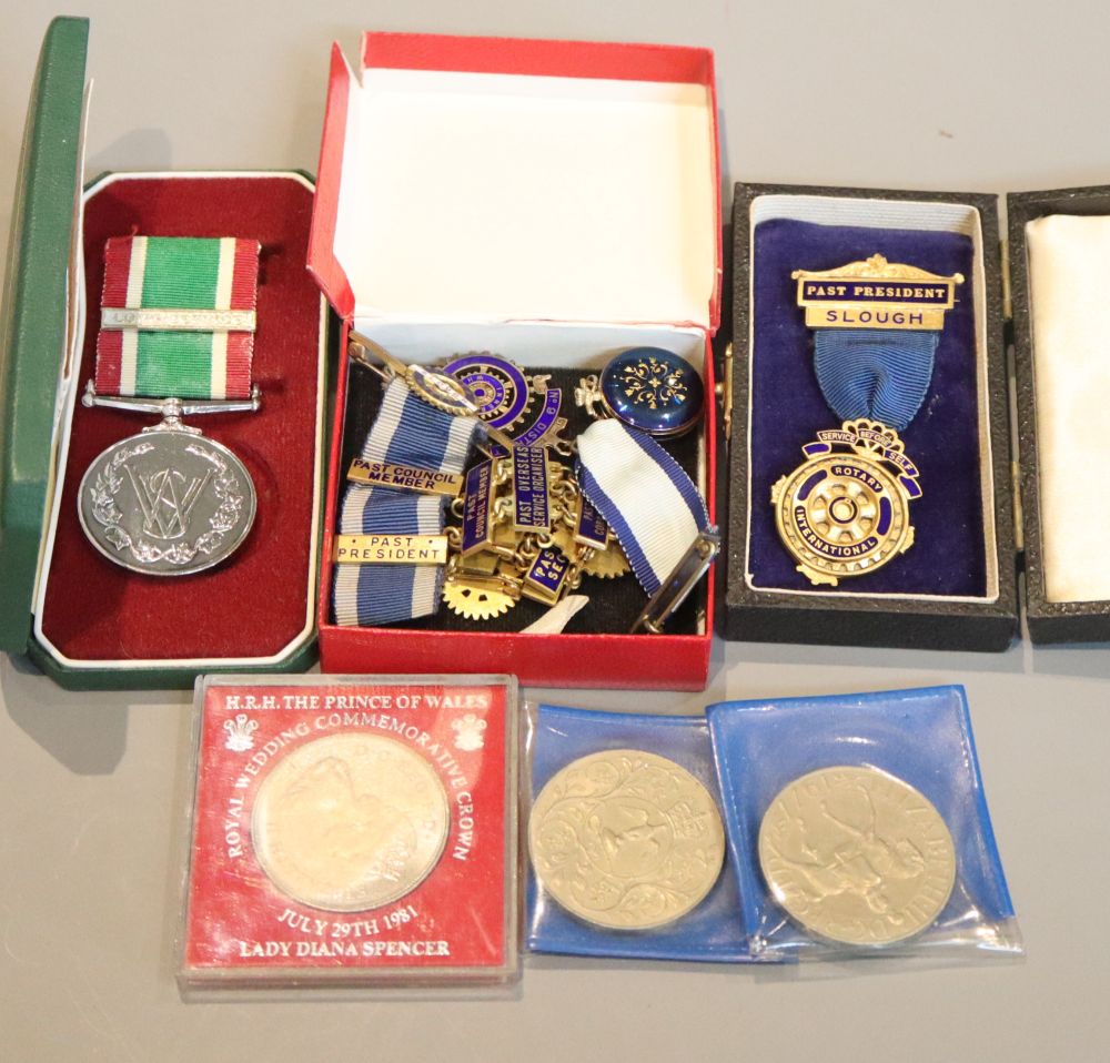 A group of medals, coins etc.